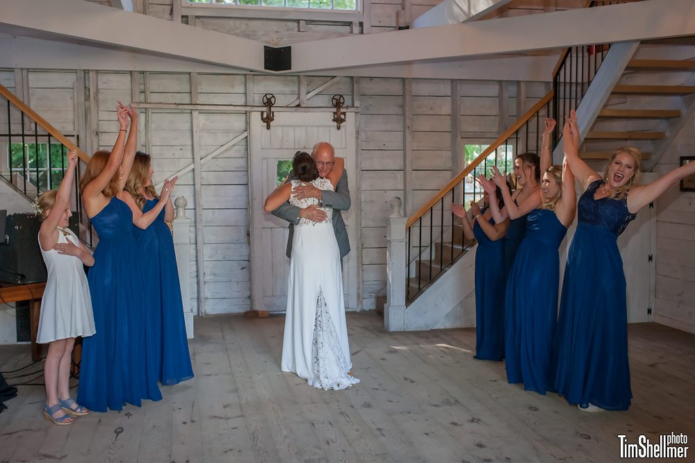 Father daughter embrace at Maine Barn wedding